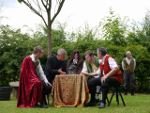 Lords fail to notice the clearly visible, but dead Banquo - what actors!