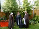 Three witches studying an Elizabethan polyurethane pot