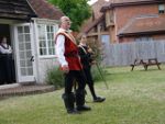 Fleance is about to stab his foot with Banquo's sword