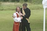 Don Pedro consoling Benedick on loosing his hair band