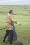 The ever angry Leonato stomps past Ursula