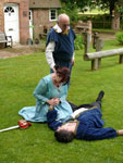 Capulet watches his wife manicure Tybalts finger nails
