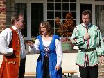 Hortensio cannot watch as Kate and Petruchio have a row