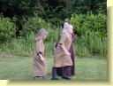 The Queen's attendants go to fetch her flowers.