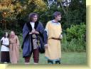 Cloten (Chris) sees something surprising on the back of Cymbeline's neck.