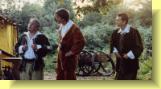 Leonate (left) and Claudio (right) listen to Benedick