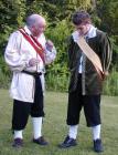 Theseus explains - very carefully - what he wants his servants to do.