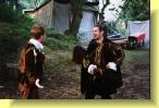 Petruchio (right) is welcomed by Hortensio